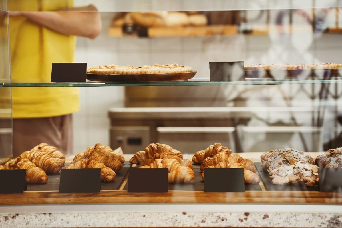 A row of pastries in a bakery